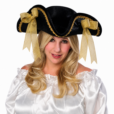 A woman wearing a black pirate hat with gold trim and two large gold ribbon bows, paired with a white off-the-shoulder costume top, against a plain white background.