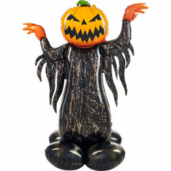 A black and orange foil balloon designed to resemble a pumpkin with a ghost face.