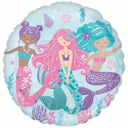 A round, jumbo foil balloon with a shimmering mermaid theme, featuring illustrations of three mermaids in vibrant colors on a blue background, surrounded by sea creatures and floral motifs.