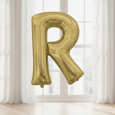 Gold letter 'R' balloon with Anagram logo on a white background