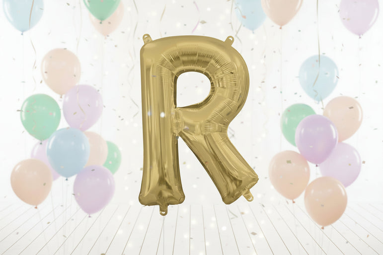 Gold letter 'R' balloon against a white curtain background