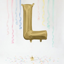 Gold letter 'L' balloon with pastel streamers and confetti on a white background