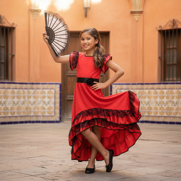 Girl in a red dress with black lace details holding a fan on a white background