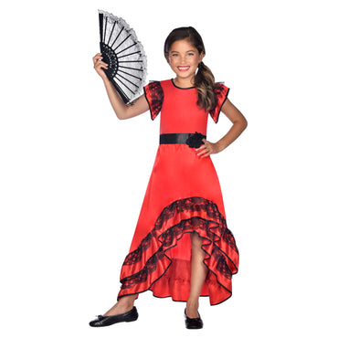 A girl in a Child Flamenco Girl Costume, which is red with black ruffles and a black belt, holding a white fan.