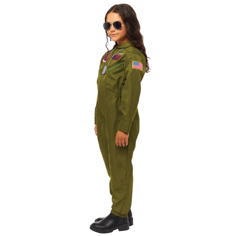 Child on side view wearing green Top Gun flight suit costume with sunglasses and patches.